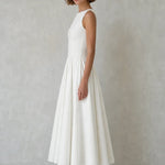 Elegance Sleeveless Pleated Midi Dress with Button Details