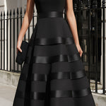 Elegant black sleeveless tiered midi evening dress