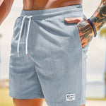 KZZ Men's Letter Patchwork Print Pocket Shorts