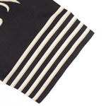 KZZ Men's two-piece set featuring a long-sleeved top and trousers with ethnic-style patterns.