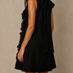 Black Sleeveless Mini Dress Featuring Striking Floral And Bow Details